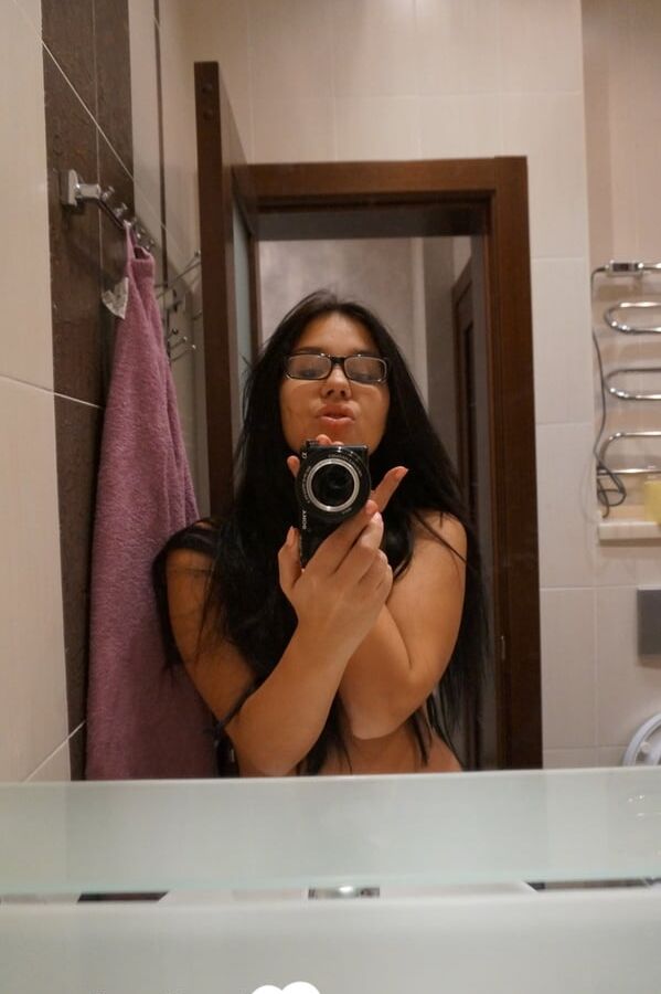 Cute nerdy babe taking some hot selfies