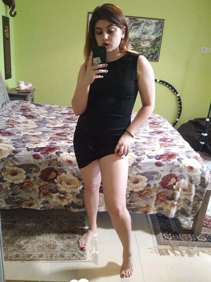 Naughty brunette strips off her black dress