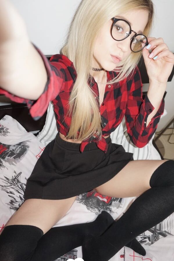 Naughty nerdy schoolgirl strips off her uniform