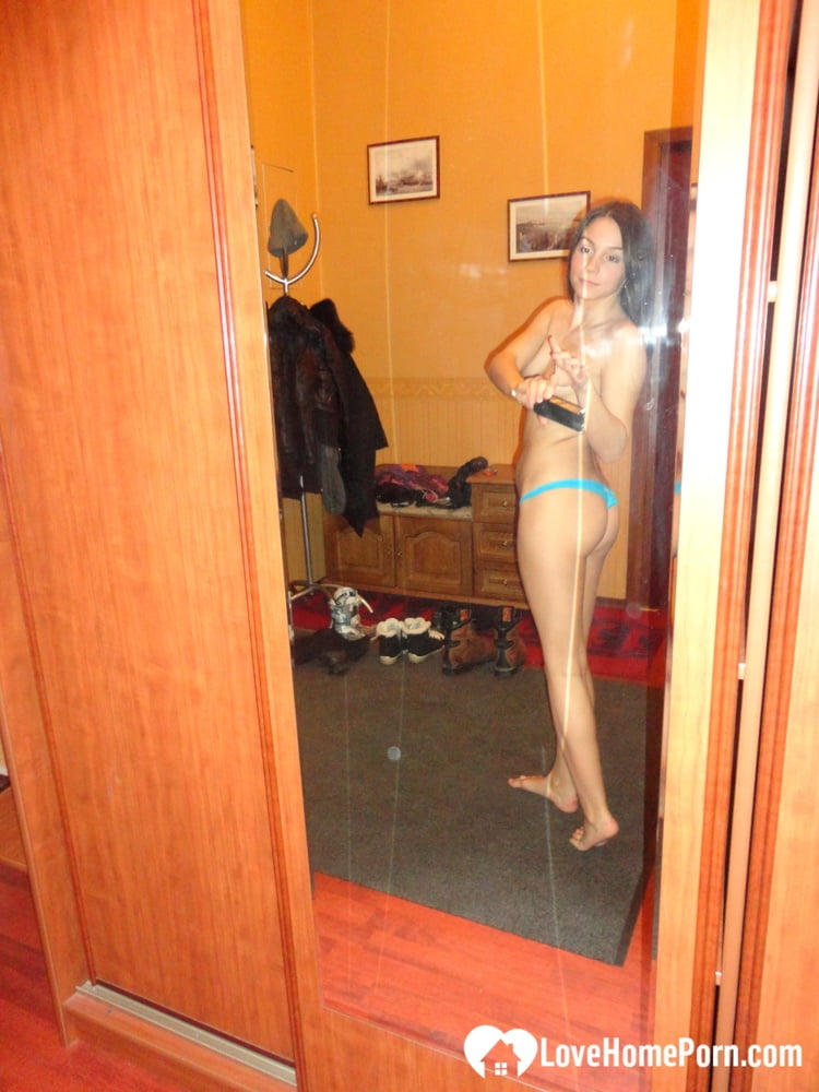 Hot teen shows her body in the mirror