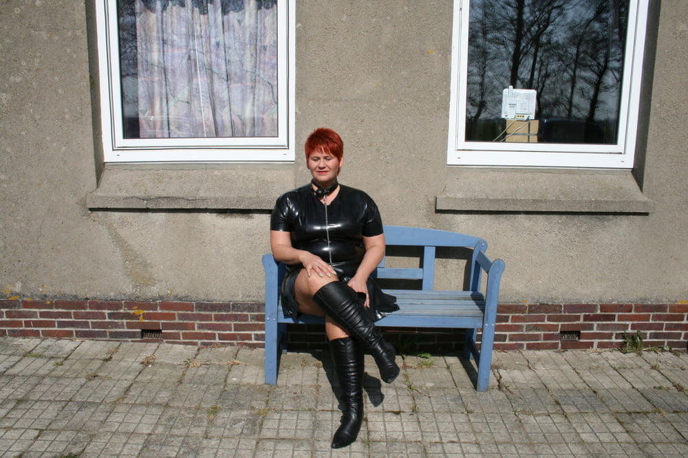 In latex outfit on the farm