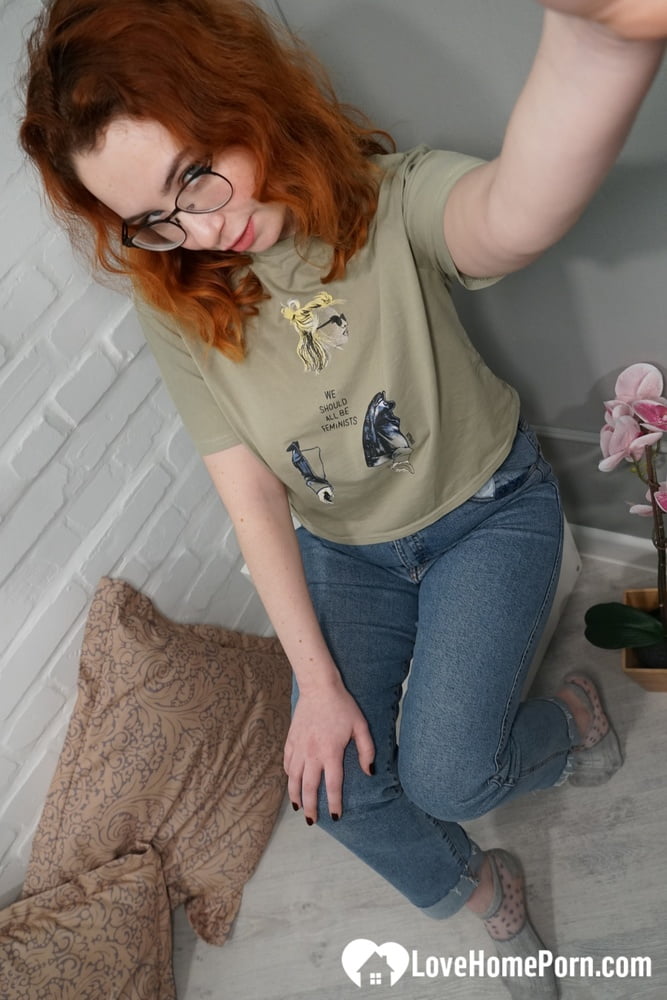 Stunning redhead in stockings shows off her ass