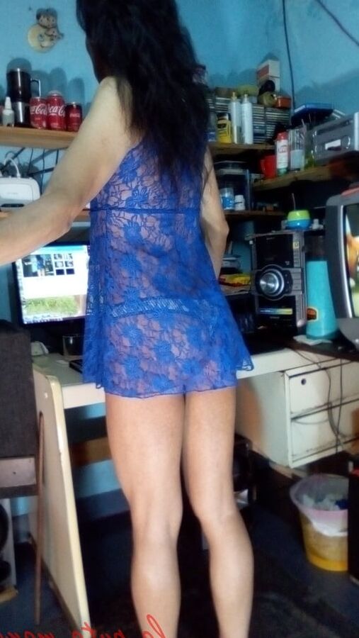 the whore maria wearing a blue dress
