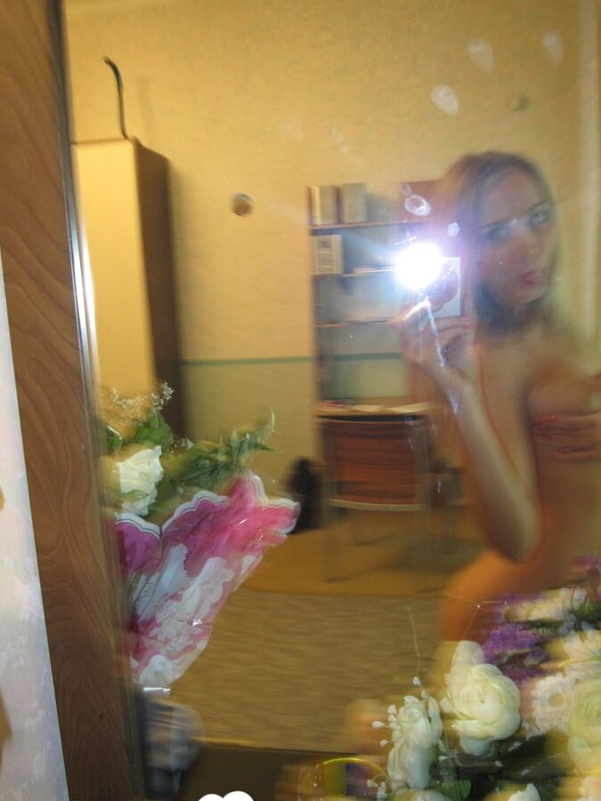 Long-legged beauty showing off her hot curves