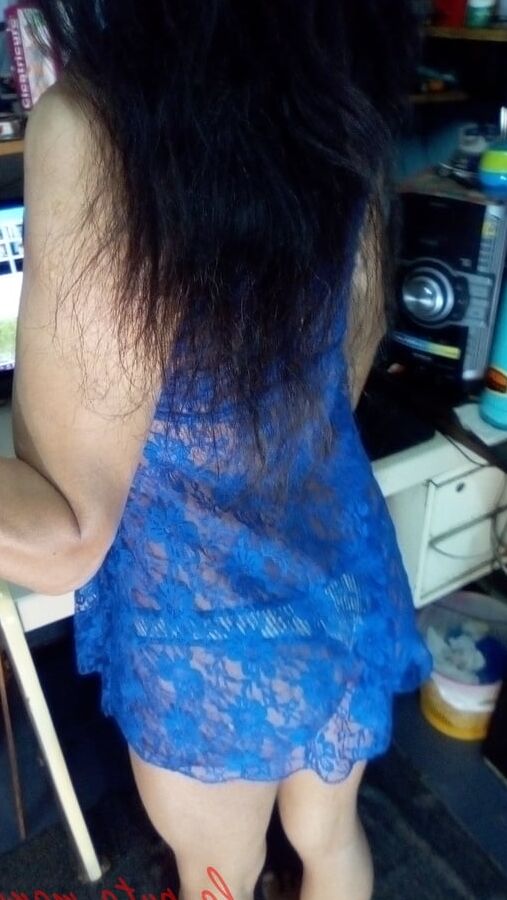 the whore maria wearing a blue dress