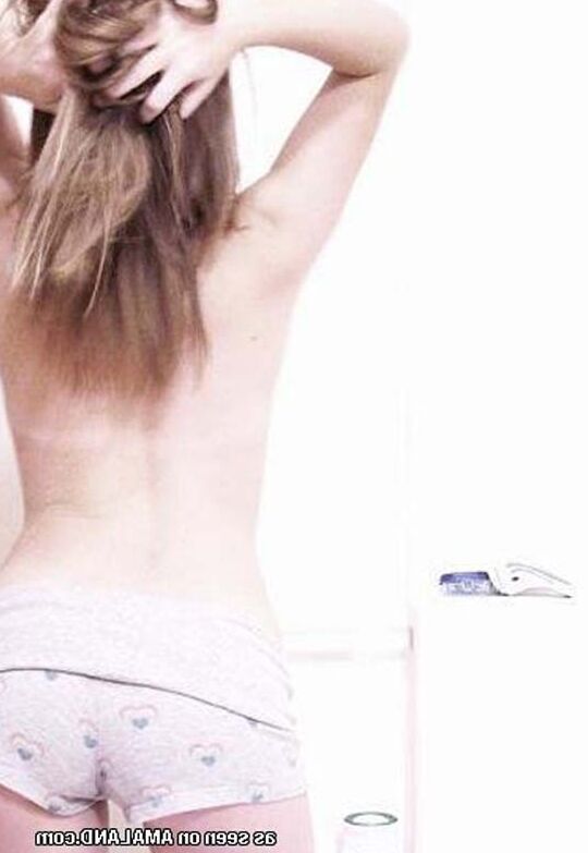 Long-legged beauty showing off her hot curves