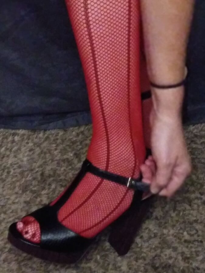 red fishnets and black heels