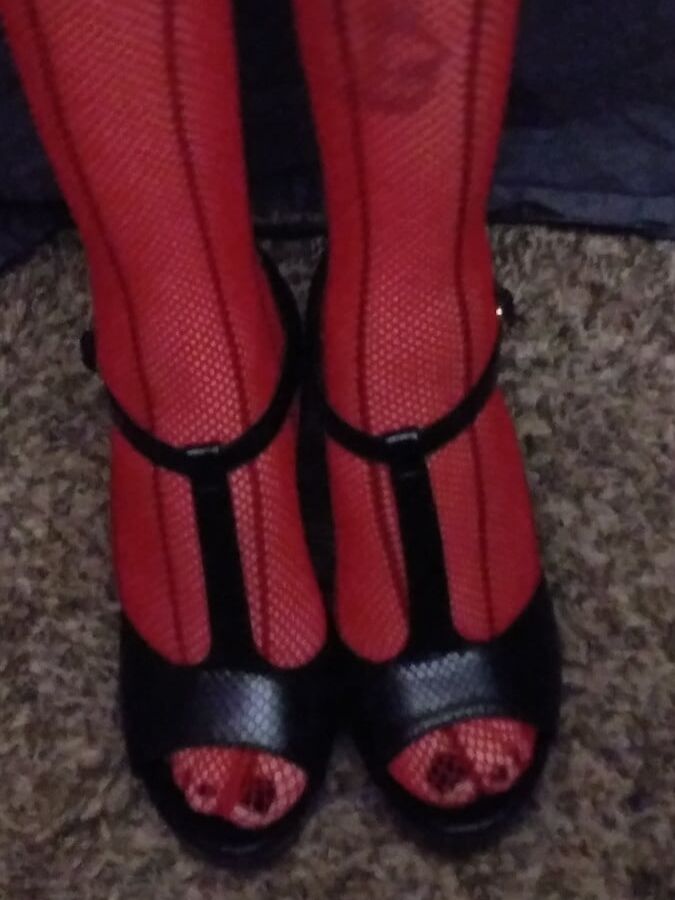 red fishnets and black heels