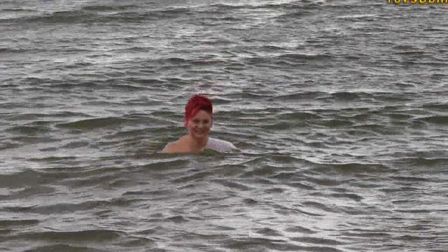 With RIPPED JEANS into the lake
