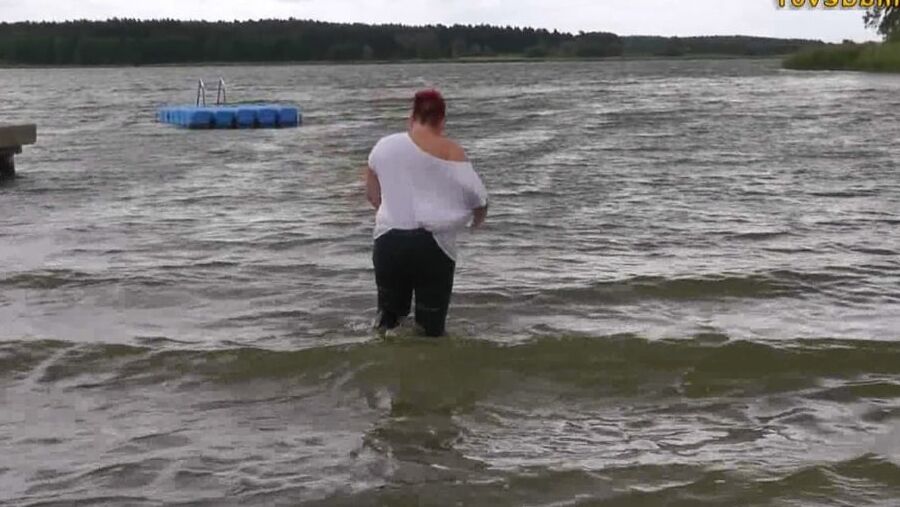 With RIPPED JEANS into the lake