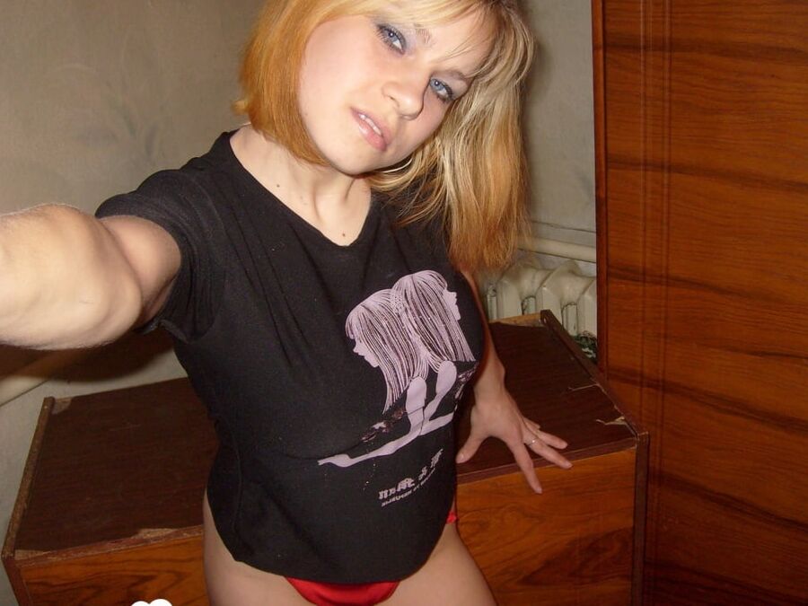 Horny babe shows off her red panties