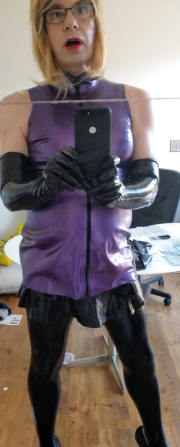 Purple latex with anal plug and pumo