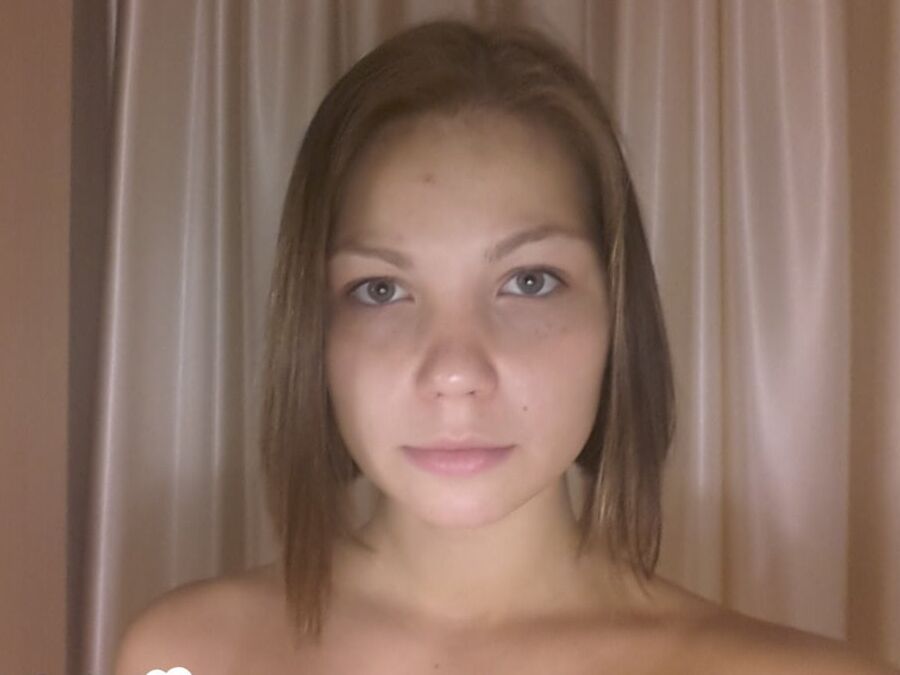Gorgeous teen displaying a new chest tattoo