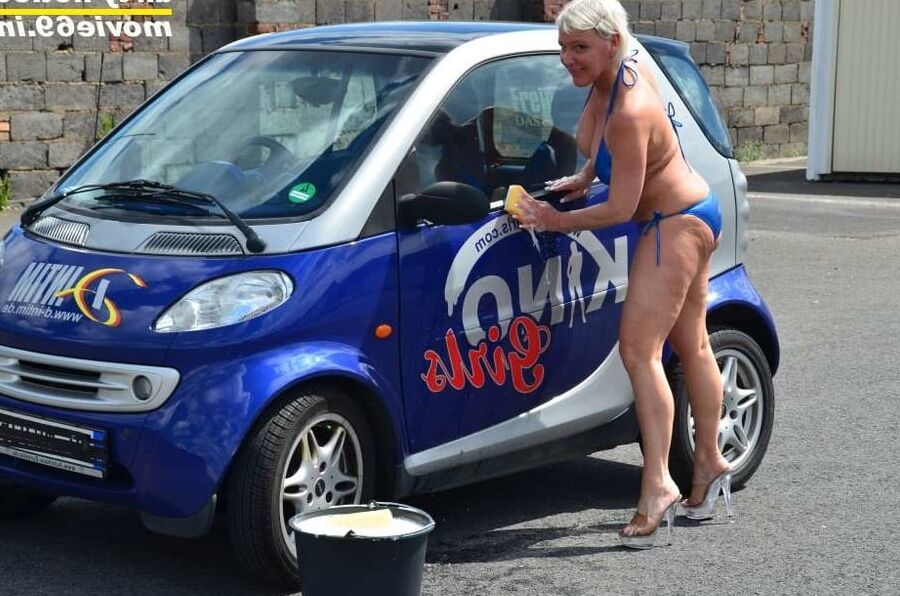 Jill Summer at the carwash in a bikini and topless