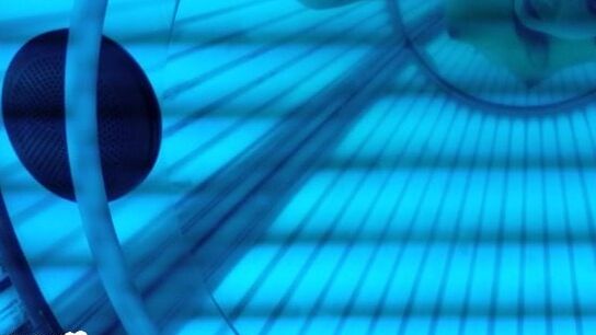 Asian sweetie taking selfies while tanning her body