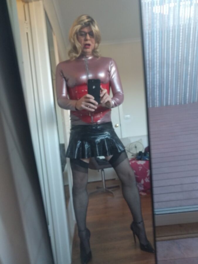 Back as a short blonde latex girl