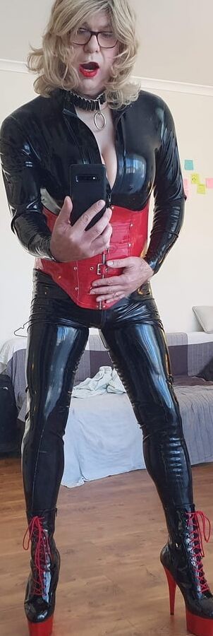 Rachel Wears a Catsuit and a Red Corset