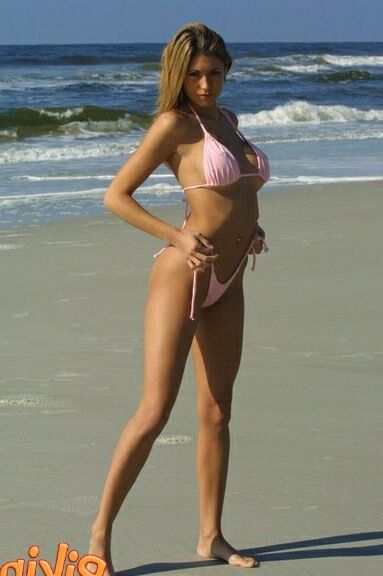 Part . Julia V Earth in white bikini at the beach.