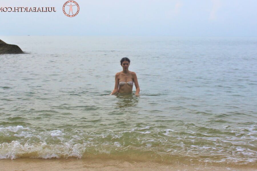Part . Julia V Earth in white bikini at the beach.