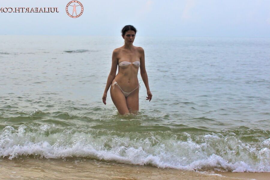 Part . Julia V Earth in white bikini at the beach.