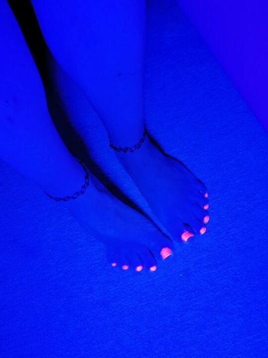 Sexy CD Feet On High Heels Posing In Neon Light