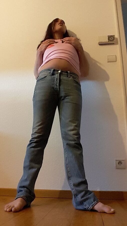 Tygra undresses and shows off her big t girl cock.