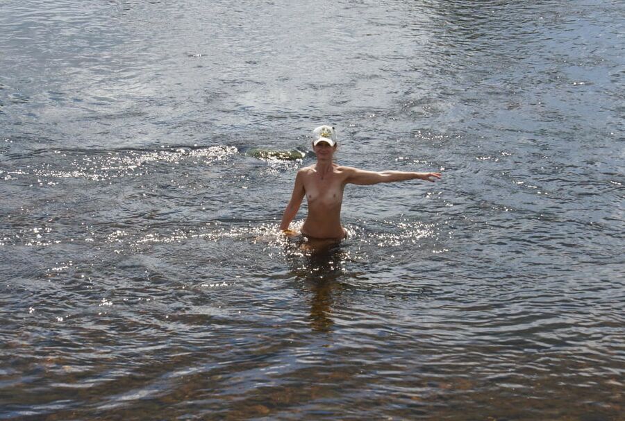 Nude in river&;s water