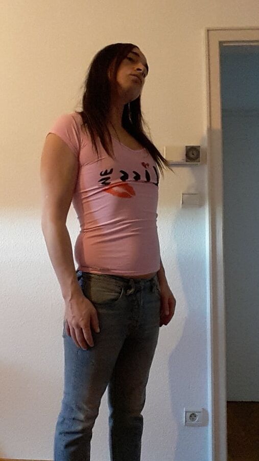 Tygra undresses and shows off her big t girl cock.