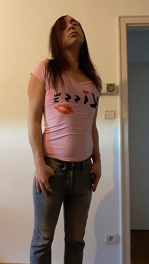 Tygra undresses and shows off her big t girl cock.