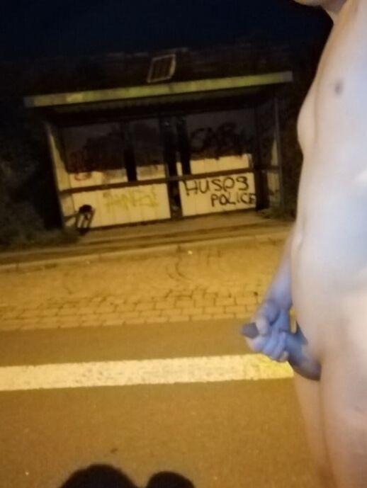 Naked at the bus stop at night
