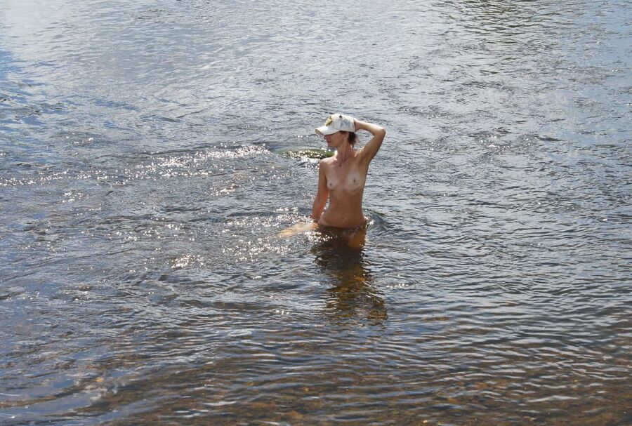 Nude in river&;s water