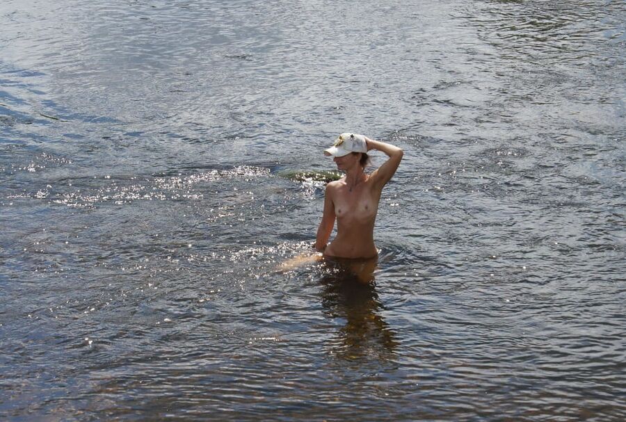 Nude in river&;s water