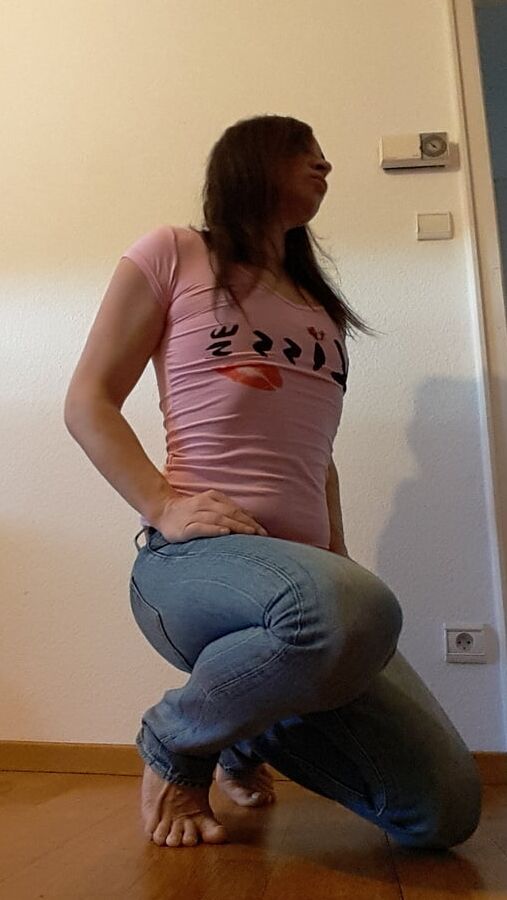 Tygra undresses and shows off her big t girl cock.