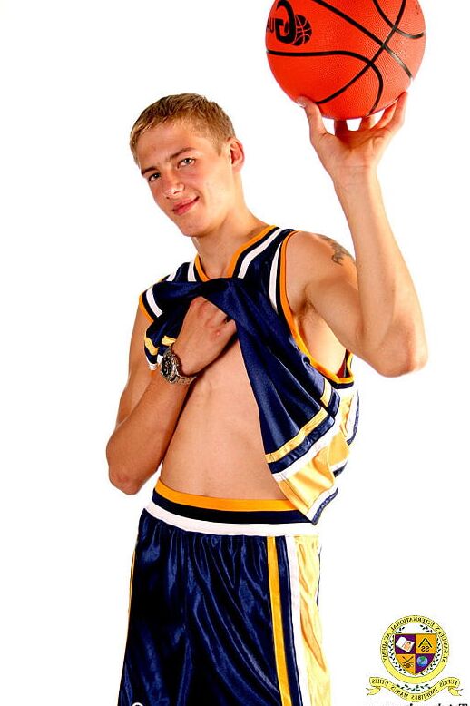 Blond teenage Latvian hunk poses in his basketball uniform