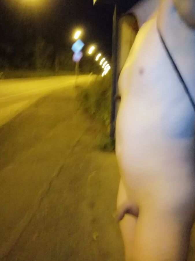 Naked at the bus stop at night