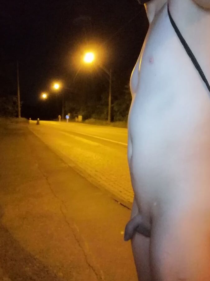 Naked at the bus stop at night