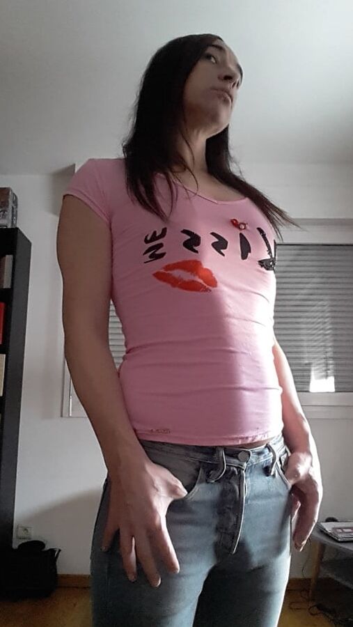 Tygra undresses and shows off her big t girl cock.