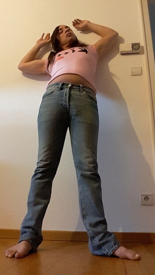 Tygra undresses and shows off her big t girl cock.
