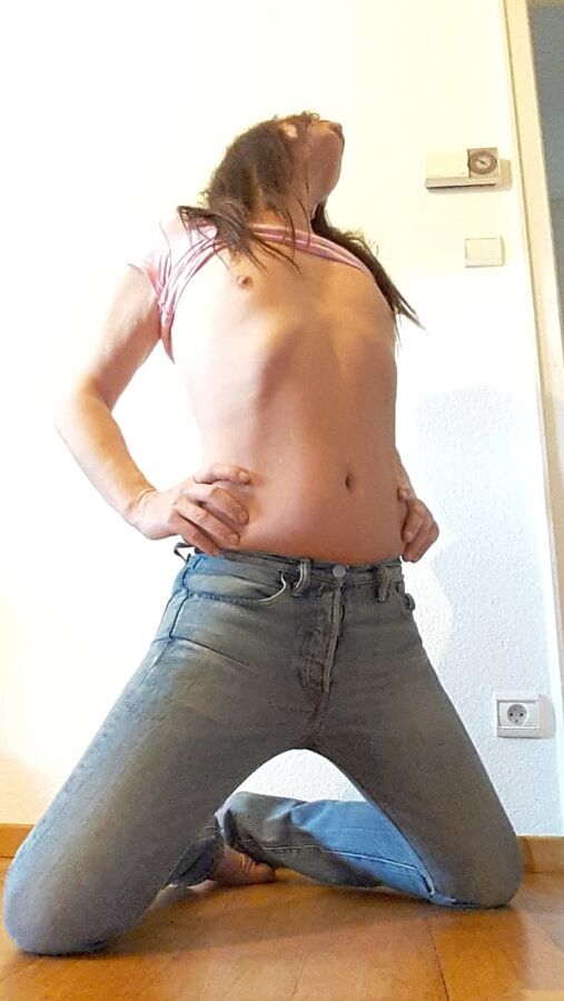 Tygra undresses and shows off her big t girl cock.