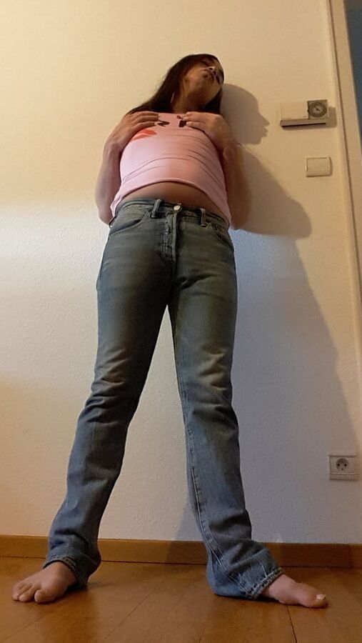 Tygra undresses and shows off her big t girl cock.