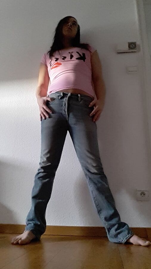 Tygra undresses and shows off her big t girl cock.
