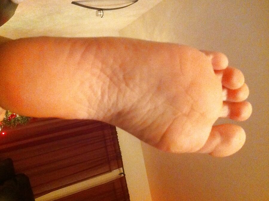 my wifes feet with long red nails