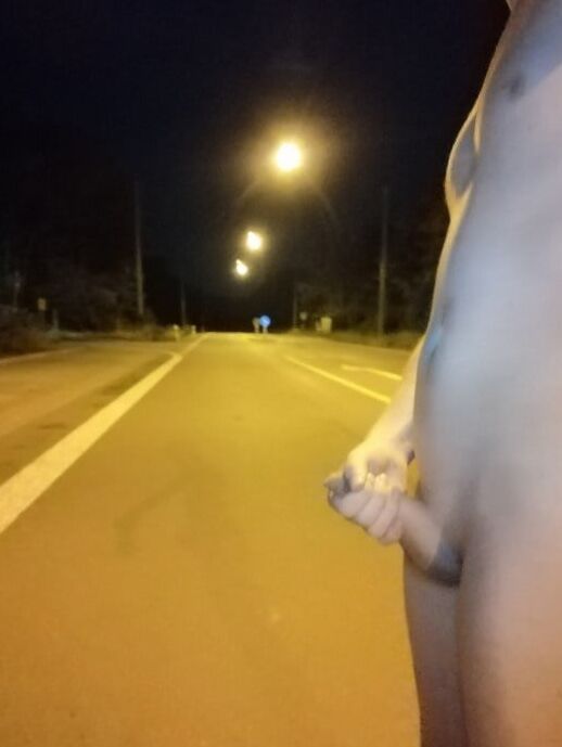 Naked at the bus stop at night