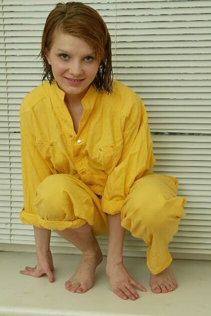 Cute Young Redhead Chick in a Yellow Shirt