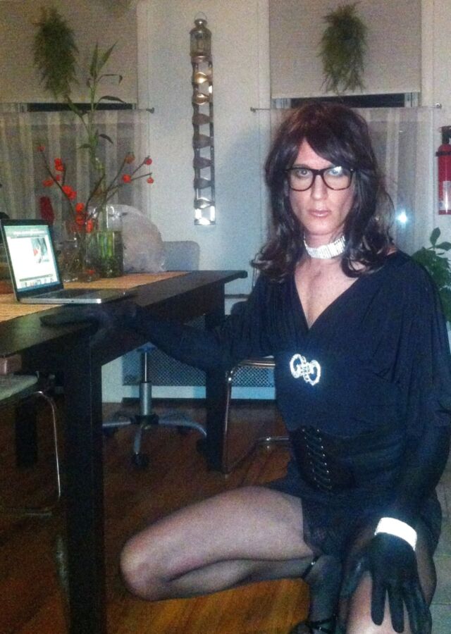Crossdresser in black party dress, seamed pantyhose