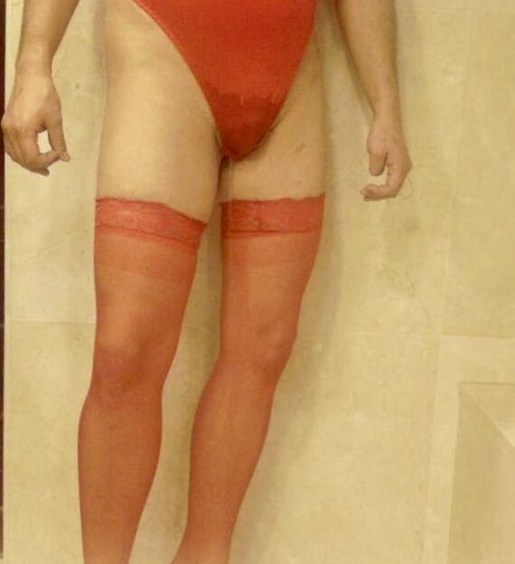 Wetting myself in my red body and stockings oops!