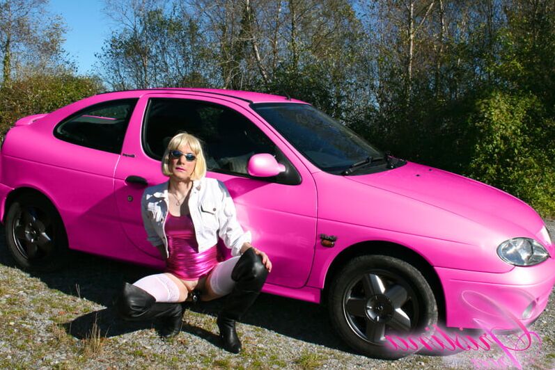 Slutty sissy in a photoshoot with her car...