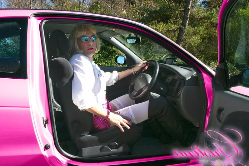 Slutty sissy in a photoshoot with her car...