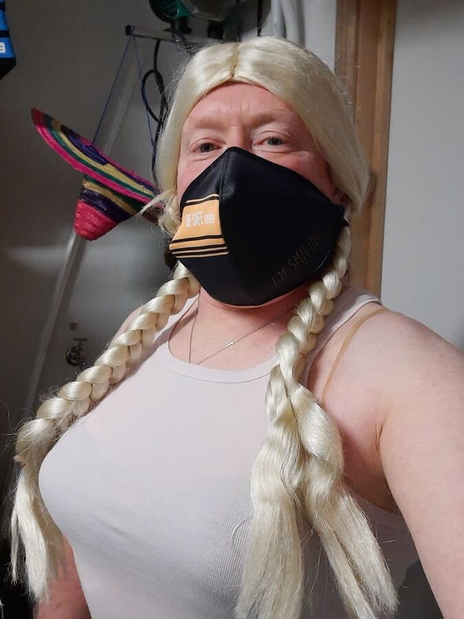 Ginger crossdresser wears bra