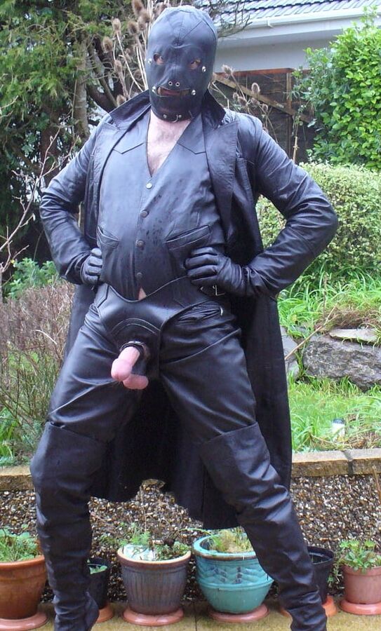 Leather Master in cock harness, boots and hood